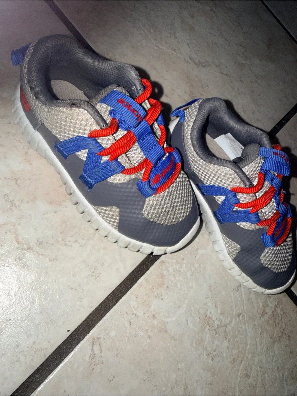 New Balance Kids Gray Sneakers with Blue & Red Details